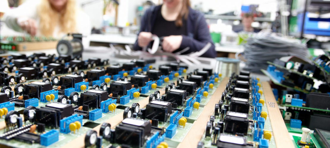 women populating electronic assemblies